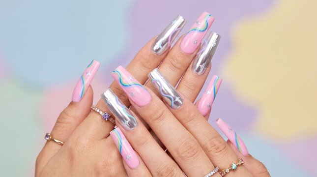 Stylish pink and silver chrome nail extensions with star art