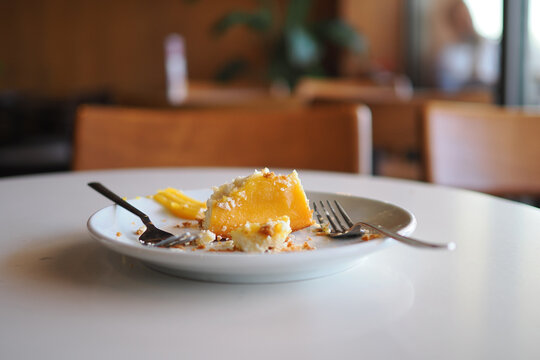 Dessert left on a table in a cafe after a meal