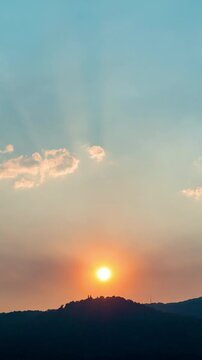 Wide angle time-lapse of scenic mountain range at sunset, dramatic cloud formations and natural beauty.