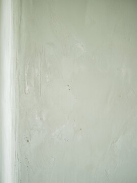 Hand painted limewash wall texture in pale sage green