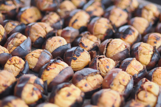 Roasted chestnuts on display at a market