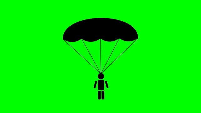 Black silhouette of a person skydiving with a parachute against a green screen background.