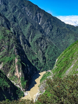 Steep canyon walls surrounding a river valley