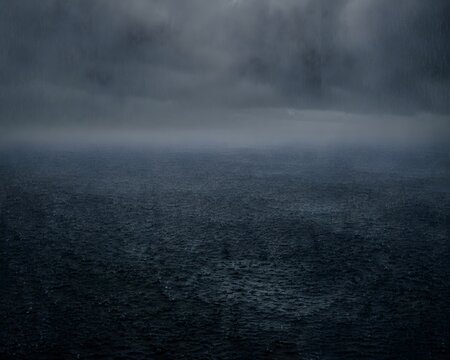 Dark ocean completely smoothed over by extremely heavy torrential downpour, no human, no brand, no text, pure visual, pr.png