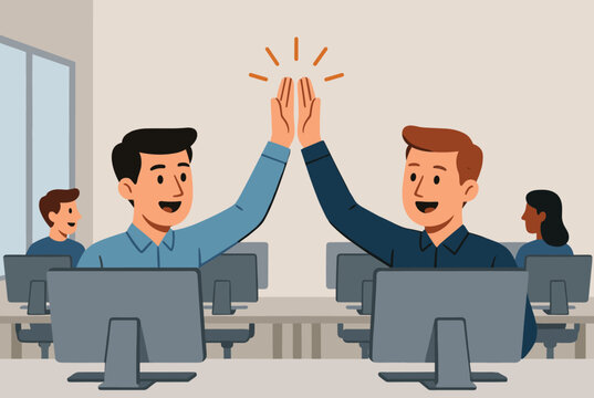 Happy male coworkers celebrate success with a high five inside a modern office with computer workstations.