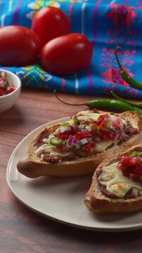 Authentic Mexican food featuring molletes on a rustic background