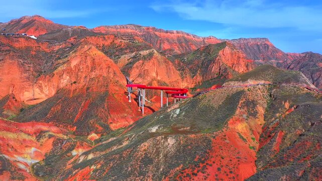 Aerial view of colorful Danxia landform, layered rock mountains formed by geological erosion in Northwest China
Vibrant striped sandstone hills, unique colorful geological landscape in Gansu Province