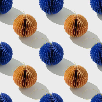 Top view of blue beige honeycomb paper Christmas ornaments in minimal Seamless pattern. Bright New Year balls with sun shadows. Festive Holiday Packaging Design, gift wrapping paper, textile design.