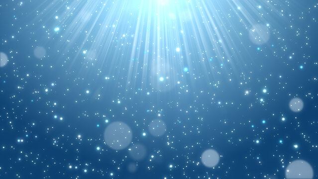 深みのあるブルーの背景に光線と輝く粒子が舞い降りる背景素材 JPG / Deep blue background with light rays and sparkling particles JPG
