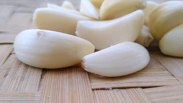 Close up photography of peeled garlic cloves highlighting their smooth texture and color
