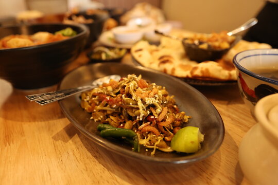 Traditional Burmese Tea Leaf Salad Served on a Restaurant Table