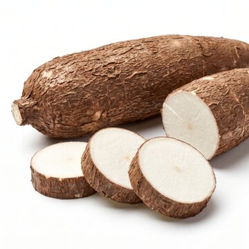 Fresh cassava root, whole and sliced, isolated on white background