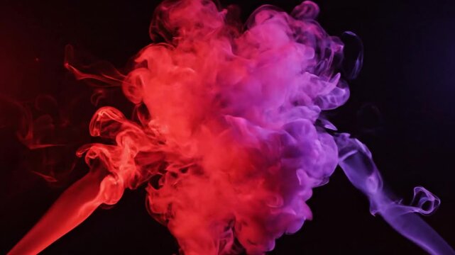 Red and Purple Smoke Swirling on Dark Background