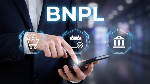 Businessman using mobile phone for buy now pay later service with digital icons