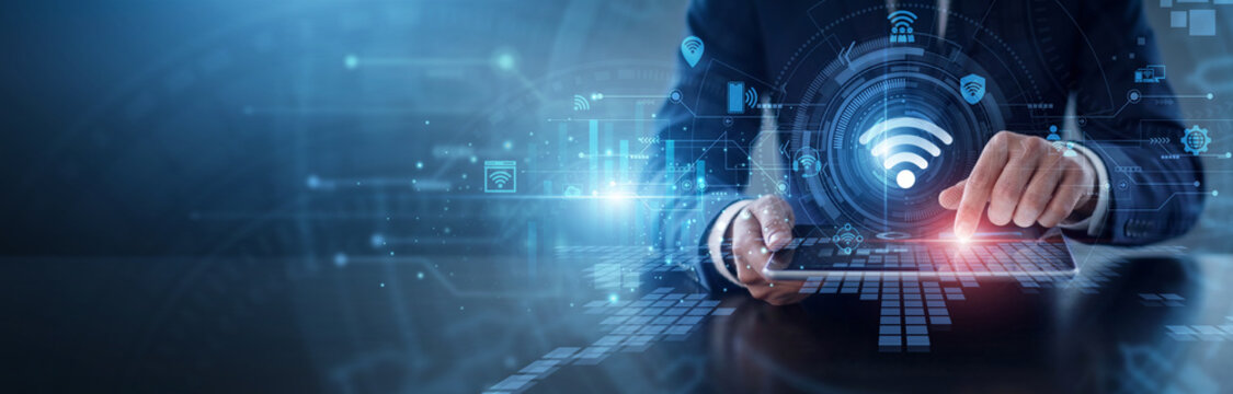 IOT device connectivity. Technician using tablet to manage smart sensors and interconnected network devices. Seamless hardware integration and advanced digital automation infrastructure.