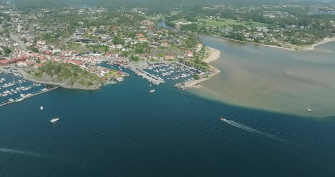 Aerial view of coastal marina and residential area in H&oslash;llen Norway