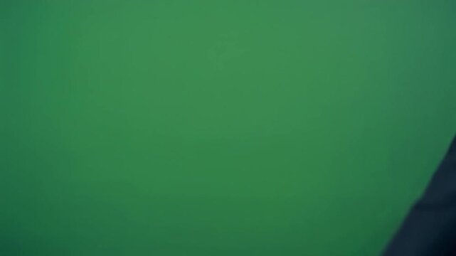 Professional human hand executing a clean single finger tap against a green screen for website landing pages, user interface demos, and corporate motion graphics overlays.