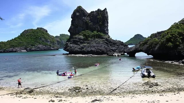Tourists Kayaking at Emerald Lagoon in Mu Ko Ang Thong Marine Park, Thailand