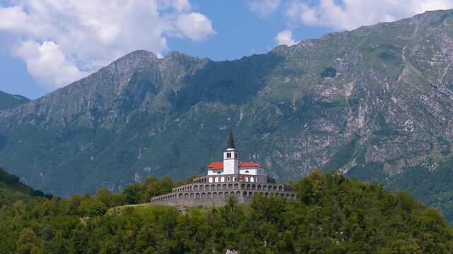 The Church Of St. Anthony Of Padua On Gradič Hill In The Town Of Kobarid In The Soča Valley of Slovenia. Aerial Rotate Shot