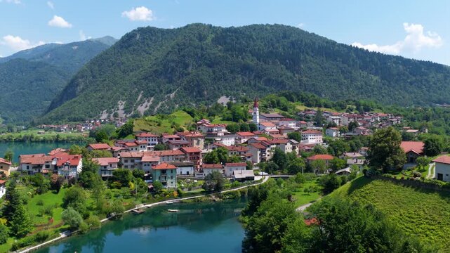 Most na Soci town and Soca river in Slovenia at daytime - aerial drone shot