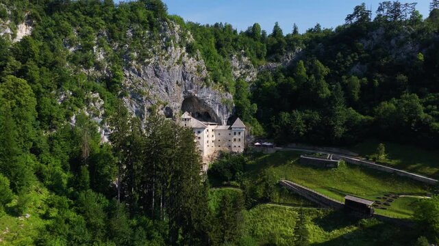 Predjama Castle in the mountains of Slovenia - drone shot