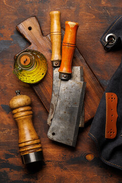 Meat cooking utensils on wooden table