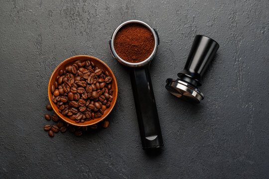 Espresso preparation tools and coffee beans flat lay composition