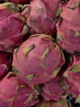 Fresh pitaya dragon fruit stack full frame close up with tropical superfood nutrition colorful
