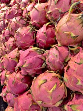 Abundant pile of pink pitaya dragon fruits with tropical superfood nutrition colorful abundance