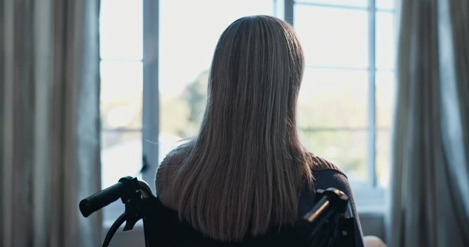 Thinking, back or old woman at window with wheelchair, daydream or nostalgia in calm mindset. Retirement, reflection or senior person with disability, flashback or peaceful perspective in home.