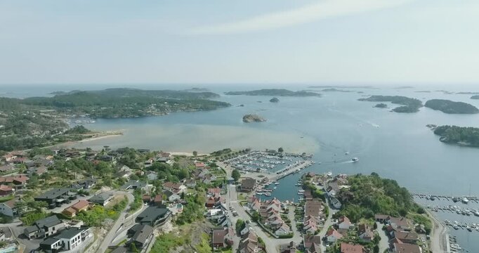 Aerial view of coastal marina and residential area in H&oslash;llen Norway