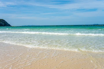 White sand beach wave sea background blue sky with fuffy cloud © themorningglory