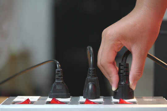 Electrical plugs with circuit breakers and fire-resistant materials for safety