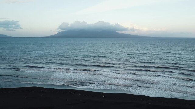 Bali Island from Java black sand beach, Indonesia
