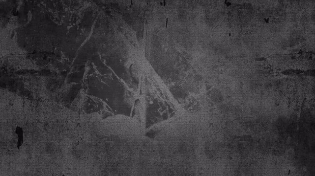 Abstract dark gray grunge wall texture with distressed paint overlay.