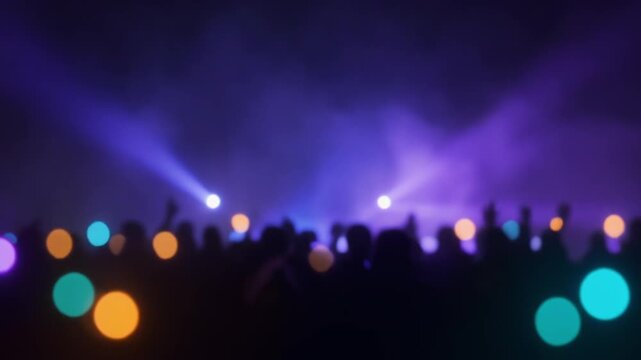 Blurred Concert Crowd Silhouette with Colorful Bokeh and Stage Lights