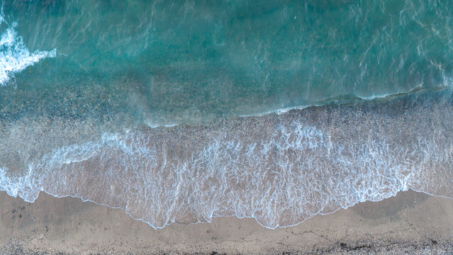 Blue Sea Waves Meeting Sandy Shoreline in Nea Moudania Greece