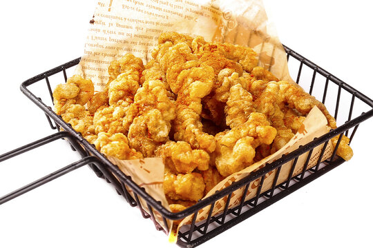 Crispy Fried Pork Rinds in Metal Basket on White Background