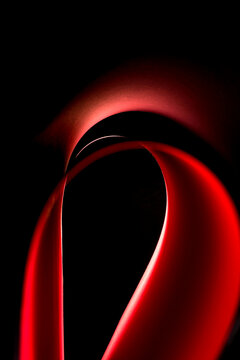 Abstract background of colored paper sheets on a black background