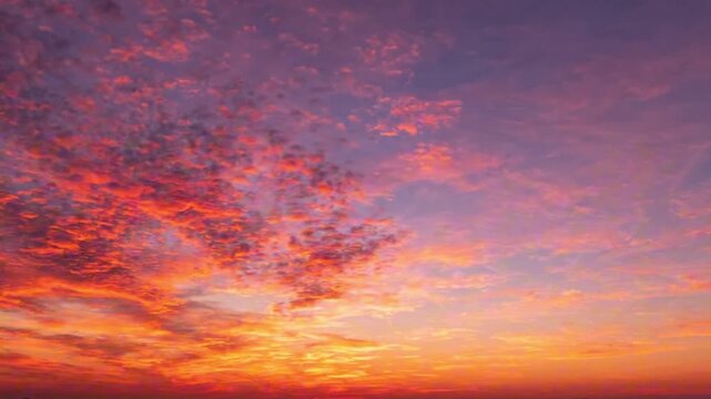 Stunning Vibrant Sunset Sky with Dramatic Colorful Clouds and Golden Horizon Glow for Atmospheric Nature Backgrounds and Scenic Landscape Prints