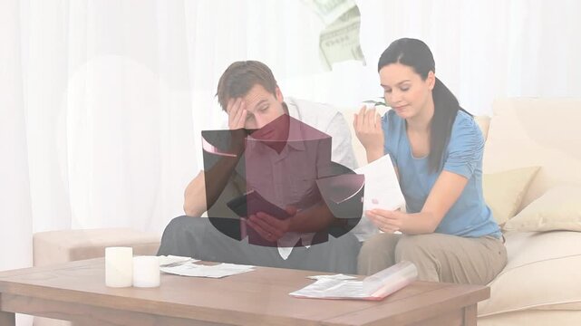 Couple sitting on beige sofa reviewing bills, 3D pie chart growing above, showing 42% for budget