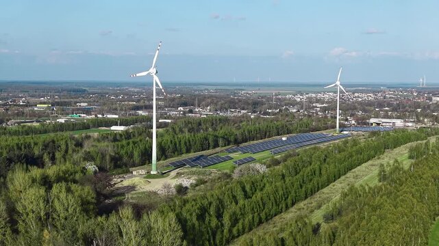 Renewable power plant featuring solar panel farm and wind turbine