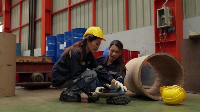 A female employee is helping her friend who was electrocuted in a metal cheese factory.(VDO 4K)	