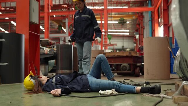 A female employee is helping her friend who was electrocuted in a metal cheese factory.(VDO 4K)	