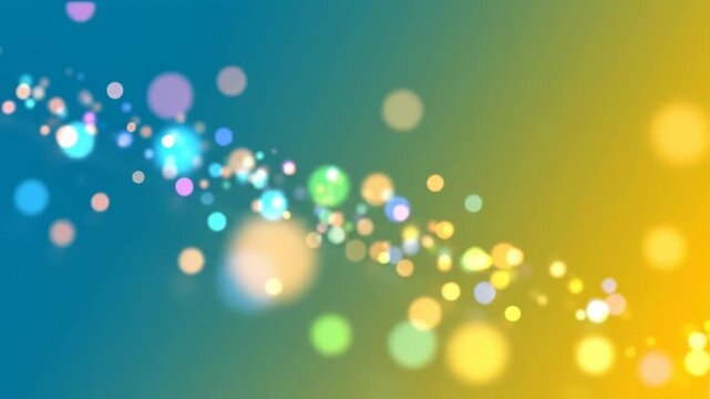Abstract colorful bokeh background with soft glowing particles and shimmering light effects floating across a gradient blue yellow and green backdrop for festive celebration and motion