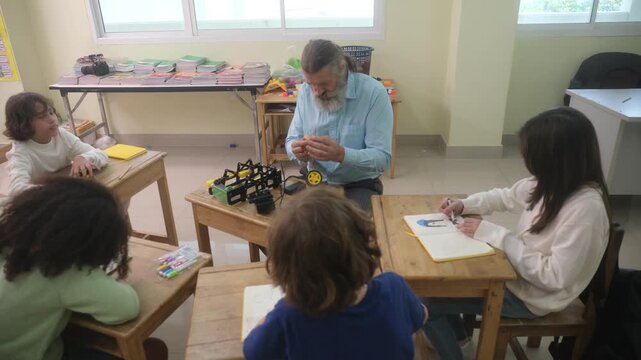 The children are conducting experiments with electric motors.
