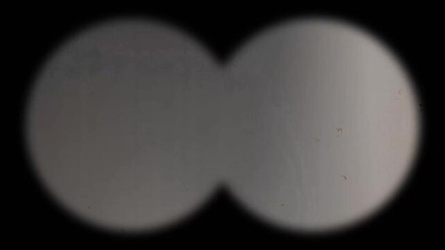 8mm Film Overlay Vintage Film Overlay Film Grain Overlay. Old Movie Overlay Film Frame Film Flicker Film Scratches Dust Overlay View through binoculars 4k video