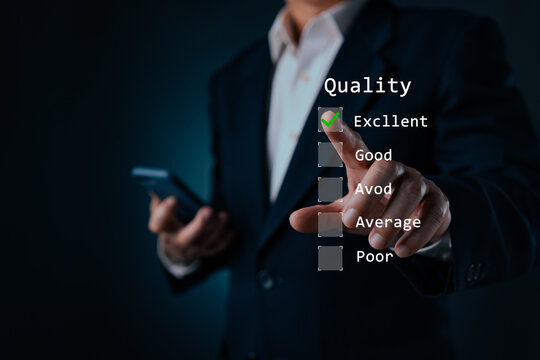 Businessman finger pointing at virtual quality evaluation checklist with excellent green checkmark. Concept of customer satisfaction, standard assessment, feedback survey, and service review.