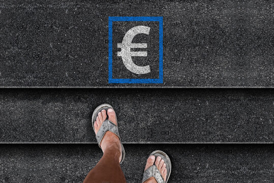 Dirty Feet in Worn Slippers Climbing Stairs Toward a Euro Sign, Economic Struggle and Aspiration Concept