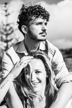 Happy couple in black and white outdoor portrait
